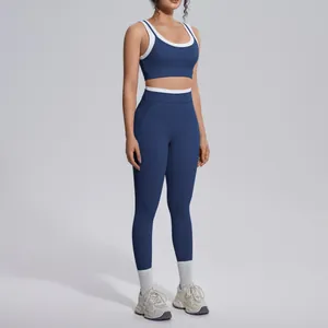 Full body view of navy blue contrast color yoga set with sports bra and leggings