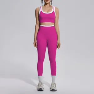 Full body view of a vibrant pink and white contrast yoga set with high-waist leggings