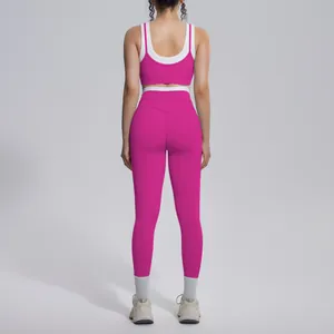 Back view of a vibrant pink and white contrast color high waist yoga set for fitness