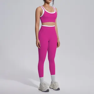 Detailed full view of a magenta yoga set featuring white contrast trim on ribbed fabric