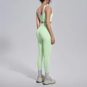 Side view showing the fit and contour of mint green yoga set on a professional model.