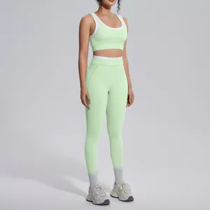 Detailed view of a light green contrast color high-waist yoga leggings and sports bra