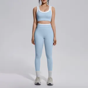 Full view of the light blue color-block yoga set with high-waist leggings on a model.