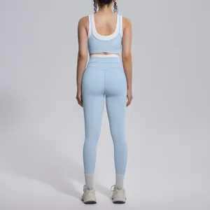 Detailed back view of a light blue ribbed high-waist yoga sports bra and leggings fitness set