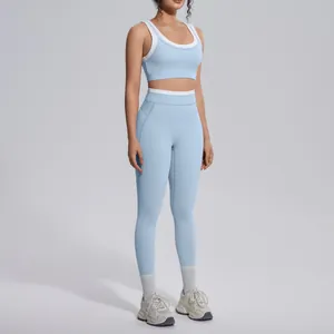 Two-piece light blue color-blocking yoga set with high-waisted leggings and sports bra.