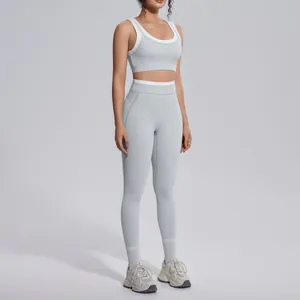 Full view of light grey ribbed high-waisted yoga set with white contrast trim details