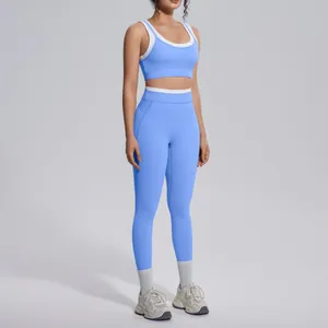 Detailed view of sky blue two-piece yoga set with white trim on female model