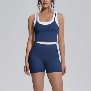 Navy blue contrast yoga set with high-waist shorts and sports bra for fitness.