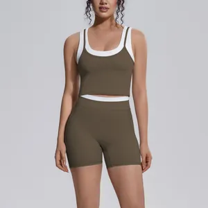 Two-piece olive and white contrast yoga set with ribbed trim and high-waisted shorts