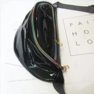 Close-up view of black shiny PVC waist bag featuring a vibrant rainbow zipper design
