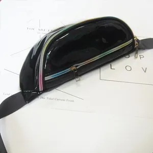 Detailed view of black glossy fanny pack featuring a vibrant holographic rainbow zipper