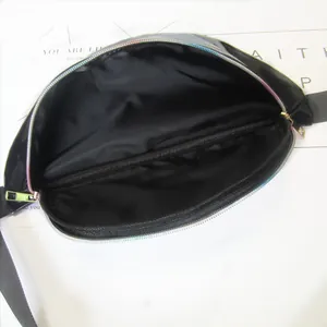 Close-up interior view of a holographic PVC waist bag featuring black fabric lining