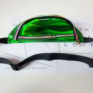 Detailed macro view of vibrant green holographic PVC texture on trendy waist bag.