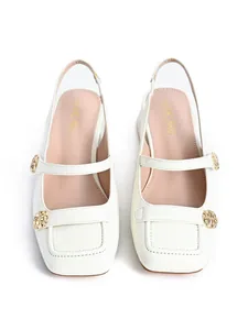 Detail view of off-white square toe Mary Jane slingback sandals with gold buckles