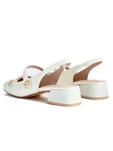Elegant off-white square-toe slingback pumps with low block heel and gold buttons