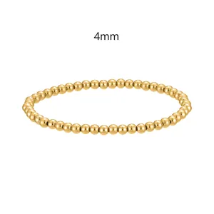 Vista dettagliata di perle in acciaio inossidabile dorato da 4mm su bracciale elastico