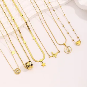 Detailed shot of various gold-toned stainless steel necklaces with minimalist pendants