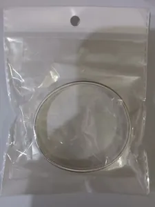 Silver metal spring arm band sleeve garter in clear retail packaging
