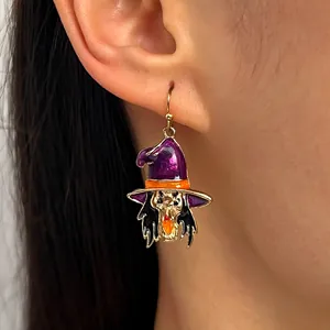 Close-up of a gothic Halloween witch drop earring featuring a purple hat design on ear