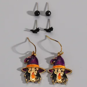 Set of Halloween earrings featuring black bat studs and purple witch hat drop earrings