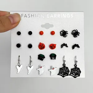 Gothic Halloween earring set featuring ghosts, spiders, and pumpkins on display card