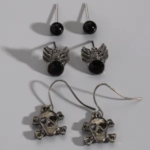 Gothic Halloween earring set featuring spider, skull, and black bead studs