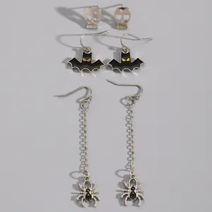 Detailed view of Halloween earring set with skull studs, bat hooks, and spider chains