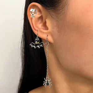 Gothic Halloween earring set featuring skull, bat, and spider charms on long silver chain