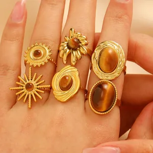 Detailed view of gold stainless steel rings set featuring natural tiger eye stones