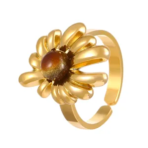 Detailed view of the golden sunflower ring with a shimmering tiger eye stone center