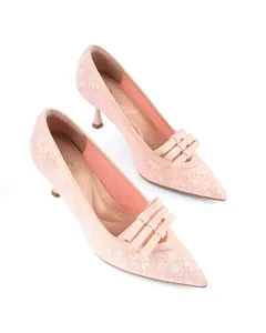 Elegant pink lace pointed-toe heels with a delicate triple-layered bow detail.