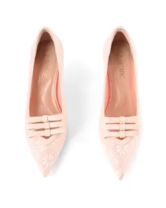 Detailed top view of elegant light pink lace pointed-toe stiletto pumps with bows