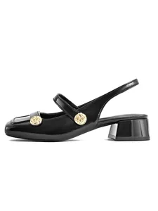 Side view of elegant black patent leather Mary Jane slingback with gold buttons