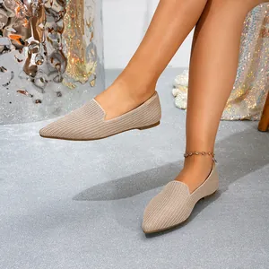 Chic beige pointed-toe fly-knit flats for women, comfortable slip-on detail view.