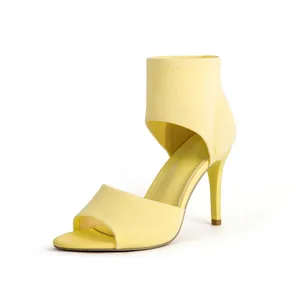 Detailed side view of yellow fly-knit stiletto high heel sandals with an open-toe design