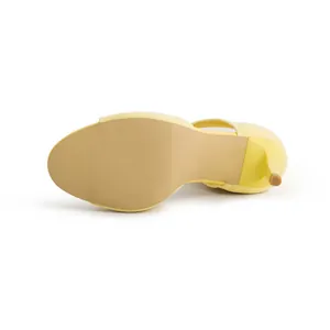 Close-up of the yellow flyknit peep-toe sandal sole and stiletto heel detail view