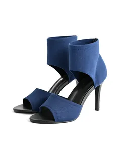 Detailed view of blue flyknit peep toe stiletto sandals with Roman inspired design