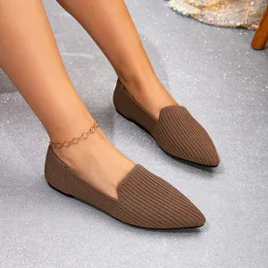 Detail view of brown pointed-toe knitted flat loafers with comfortable breathable fabric