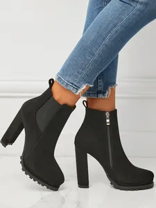 Elegant black suede chunky heel Chelsea boots with side zipper and elastic side panels.