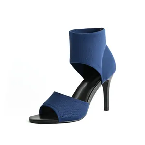 Detailed view of elegant blue fly-knit open-toe stiletto high-heel sandals for women