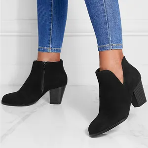 Stylish black suede ankle boots for women featuring round toe and block heel shoe