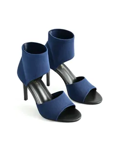 Detailed view of blue knit peep-toe stiletto sandals with sleek black high heels