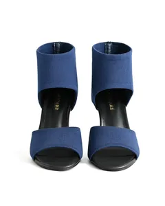 Detailed view of blue fly-woven peep-toe high heel sandals with slim heels