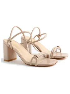 Elegant beige square toe block heel sandals featuring knotted strap details and a nude finish.