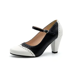 Detailed side view of black and white brogue Mary Jane high heels with a chunky heel