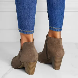 Detailed back view of stylish brown suede chunky heel ankle boots with side zipper closure