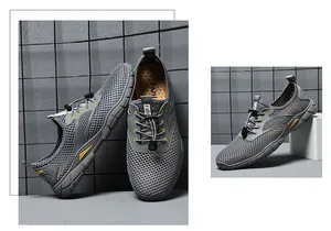 Detail van ademende grijze mesh outdoorschoenen met snelvetersluiting en antislipzool.