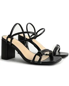 Detailed view of elegant black block heel sandals with square toe and strappy design
