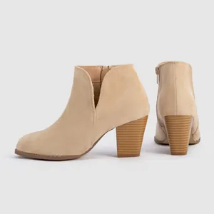 Detailed side and back view of beige suede round toe ankle boots with chunky heel