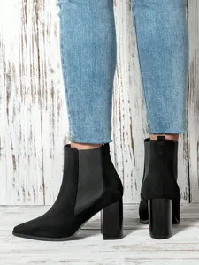 Detailed side and back view of black suede block heel Chelsea boots for women